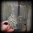 Hamsa hand earrings-Esoteric ear hangers For Sale